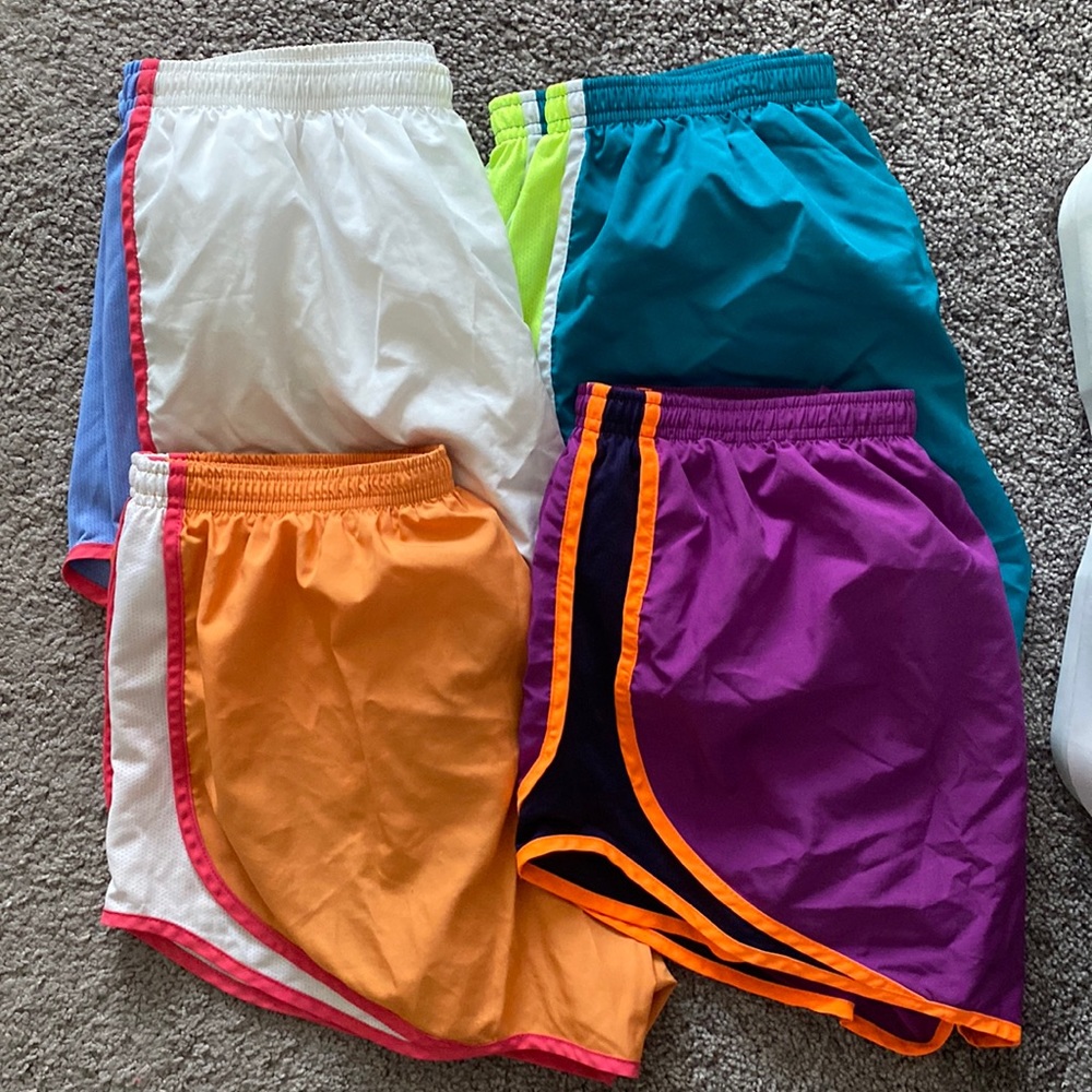 Set of 4 Nike running shorts. Barely worn- great condition